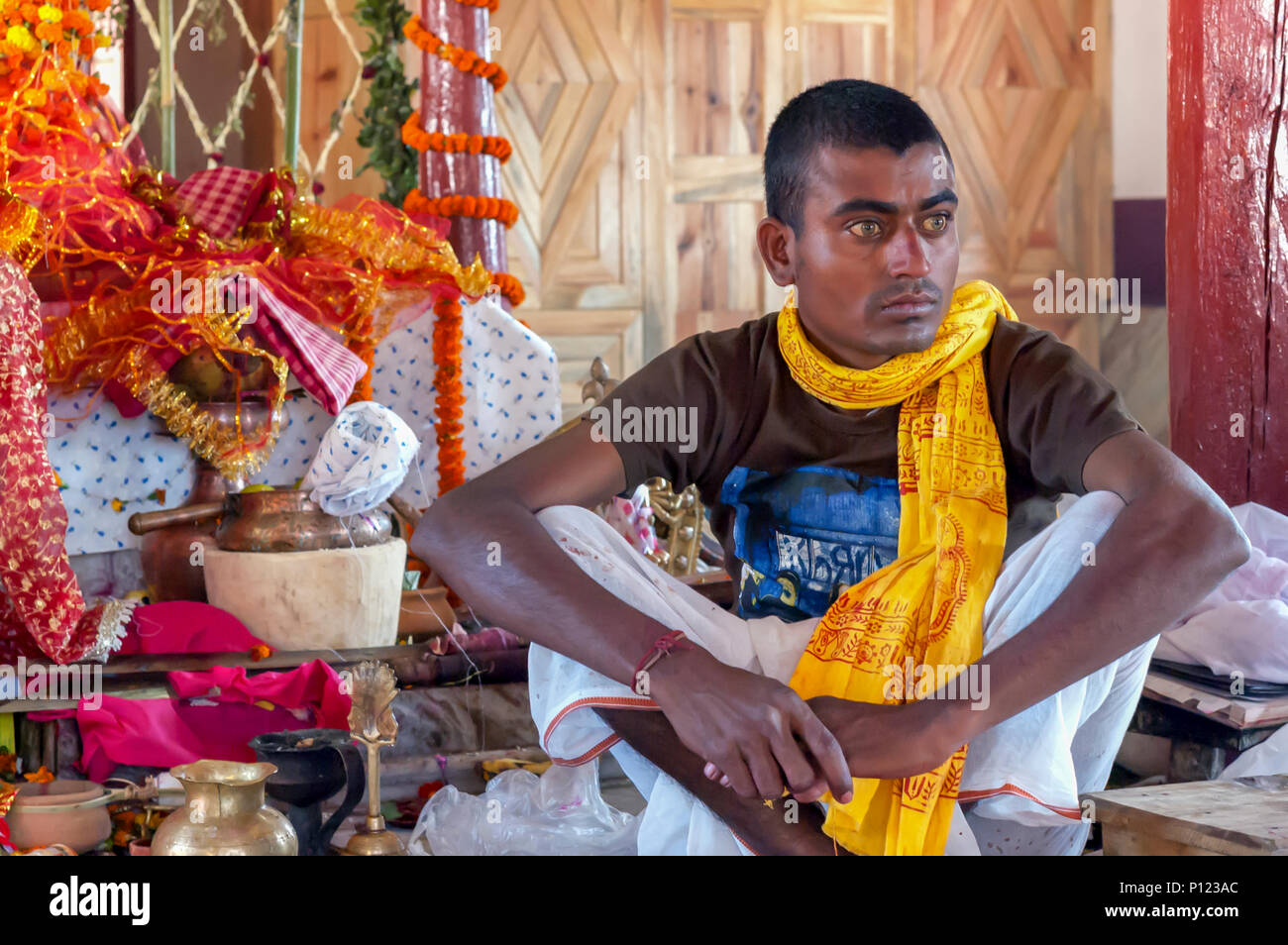 A Hindu priest with hazel eyes at the 500 year old Nartiang Durga Temple in Nartiang, Meghalaya. The temple is considered a Shakti Peetha. Stock Photo