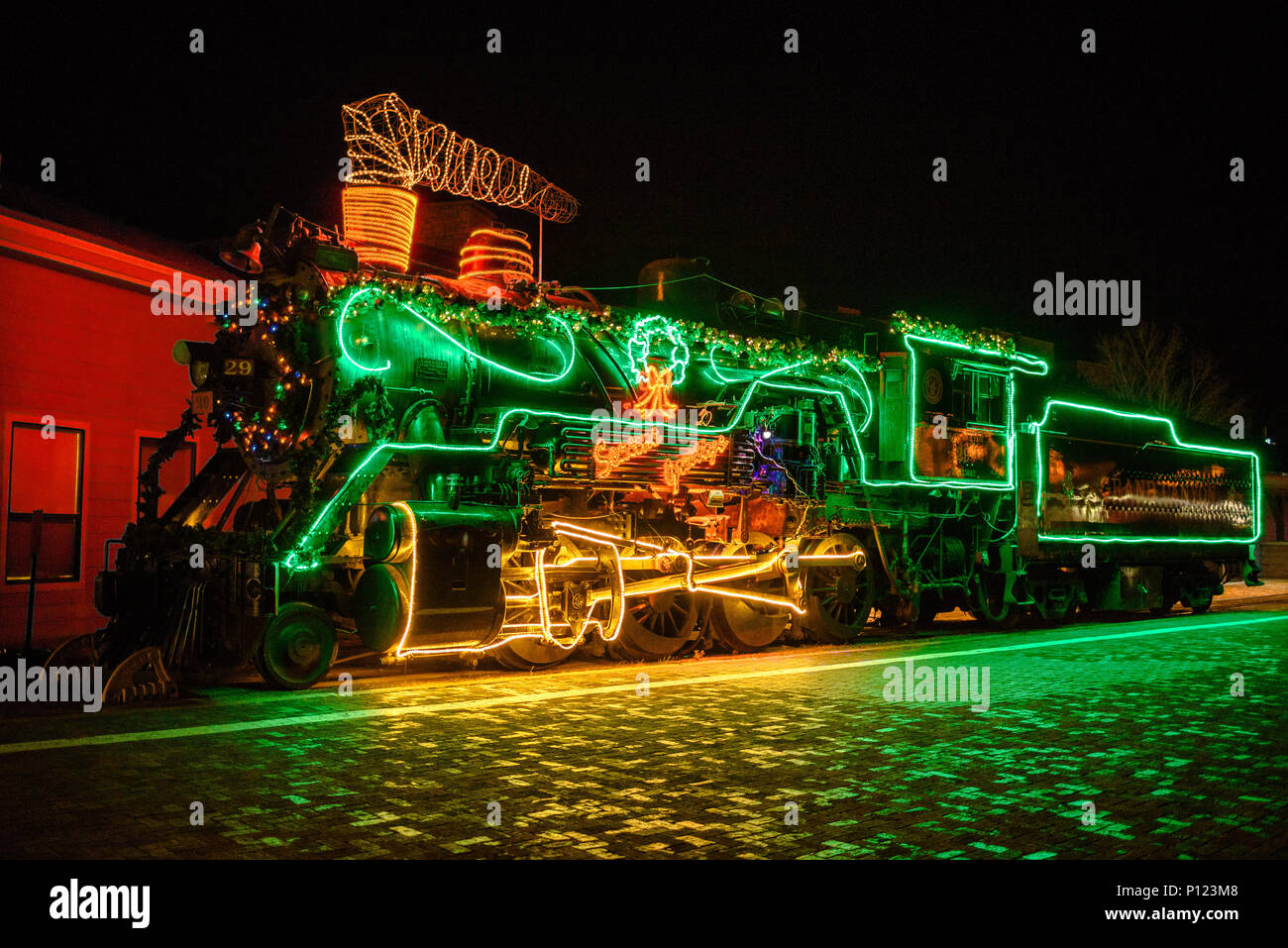 A steam locomotive decorated with Christmas lights in Williams, Arizona Stock Photo