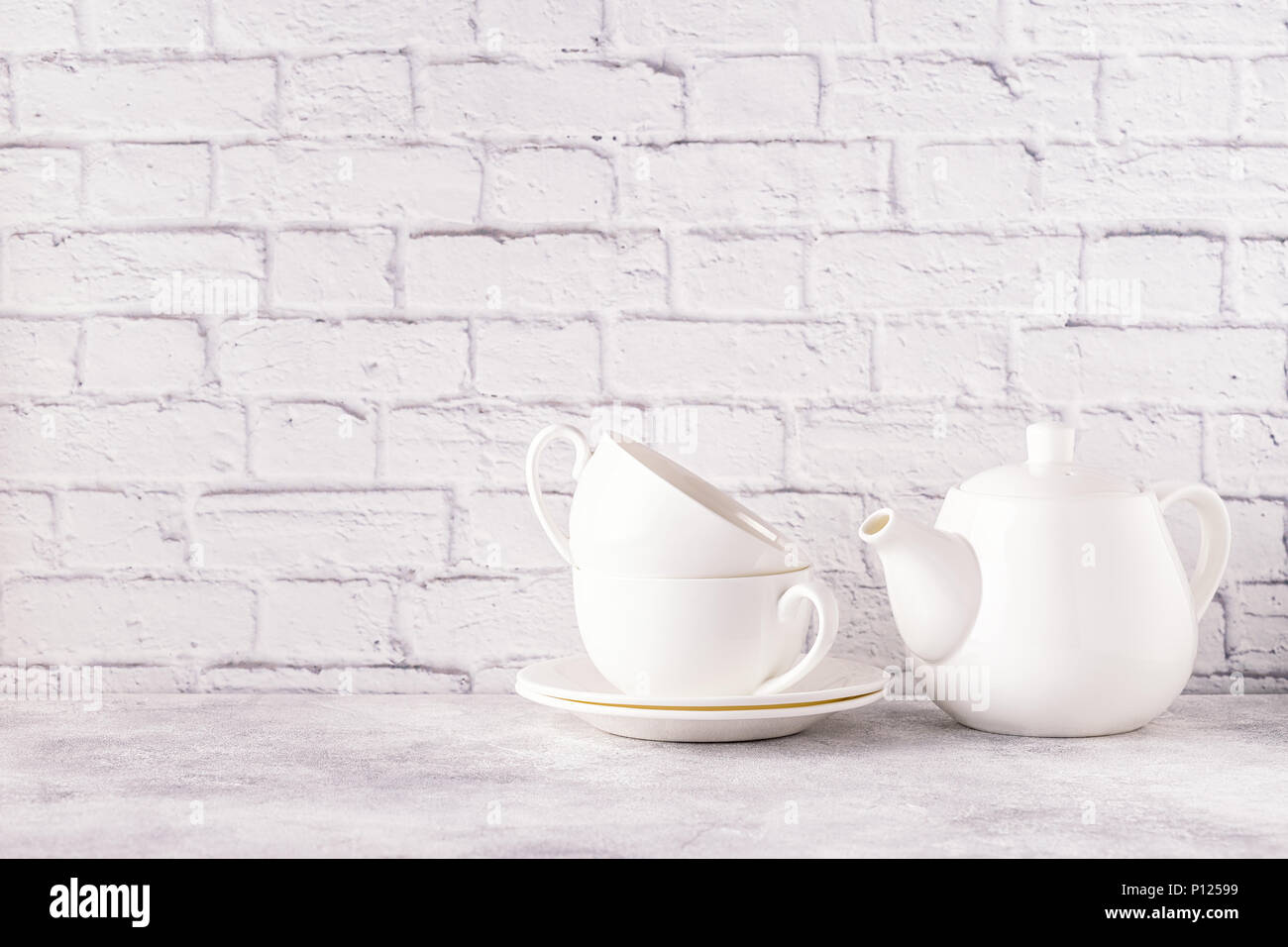 Two cups and teapot for morning tea. Copy space. Stock Photo