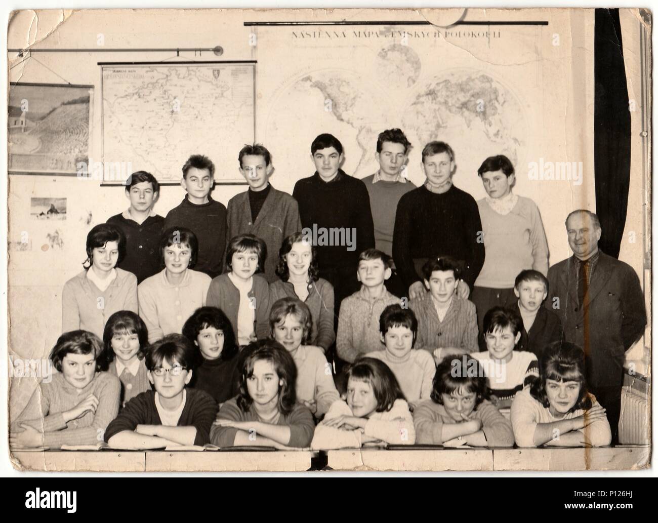 THE CZECHOSLOVAK SOCIALIST REPUBLIC - CIRCA 1960s: Retro photo shows students with male teacher in the classroom. Stock Photo