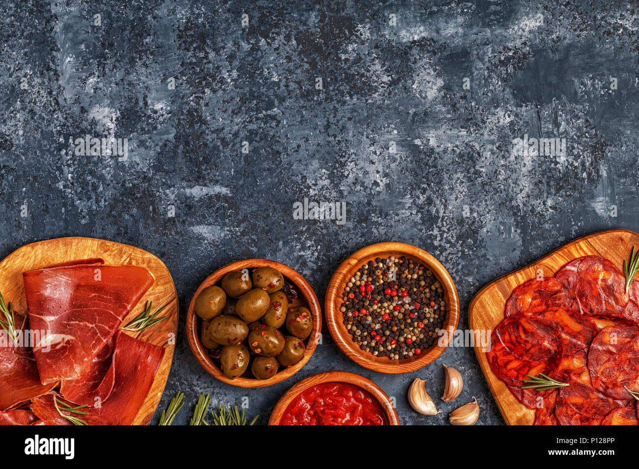 Spanish tapas with chorizo, jamon, picnic table, top view Stock Photo