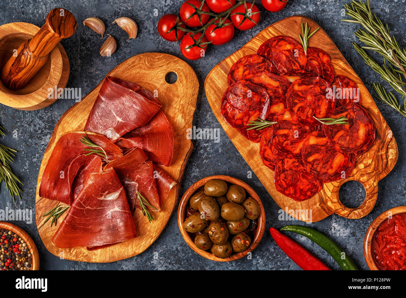Spanish tapas with chorizo, jamon, picnic table, top view Stock Photo
