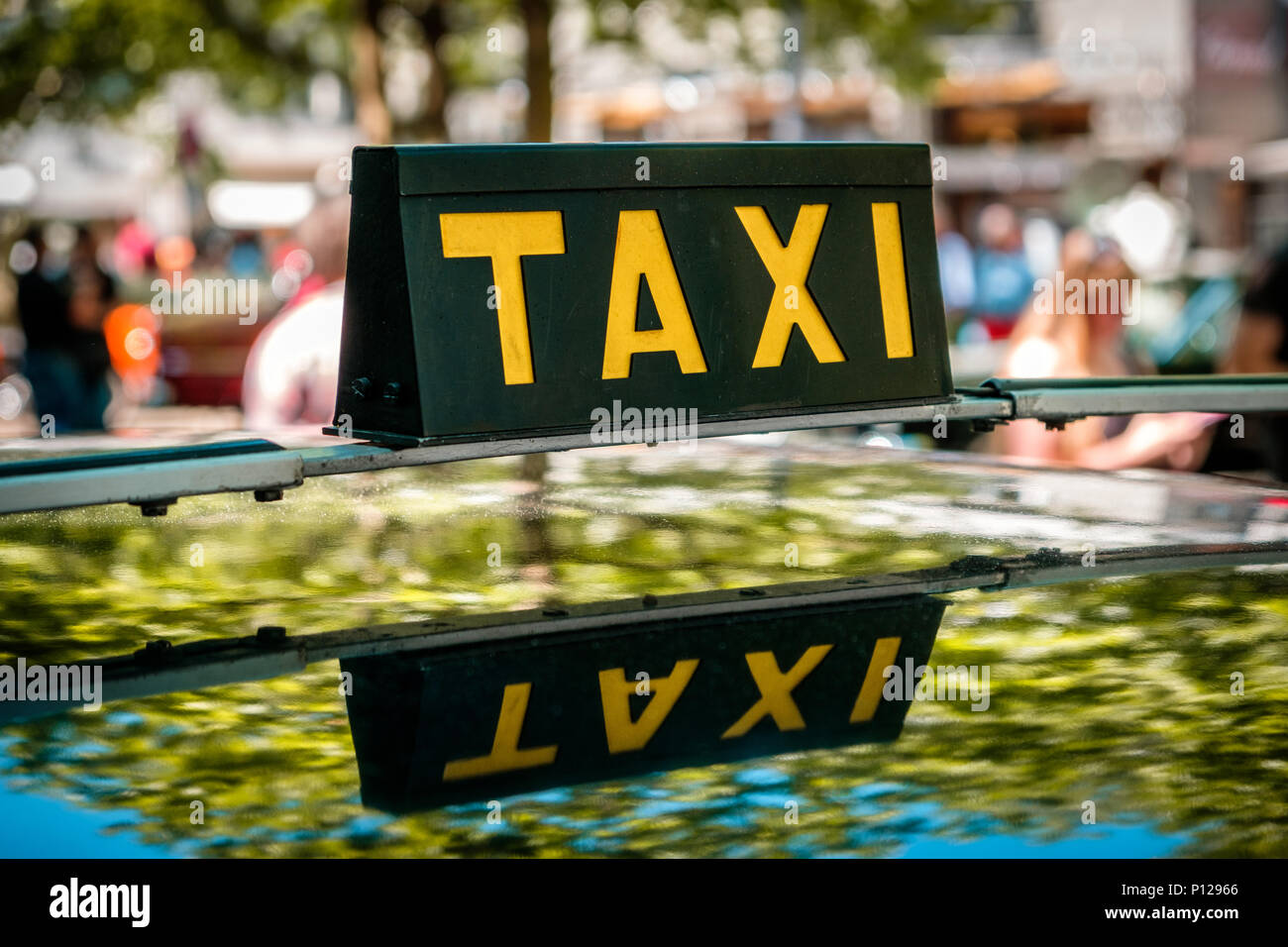 vintage taxi sign on car roof - cab driver Stock Photo