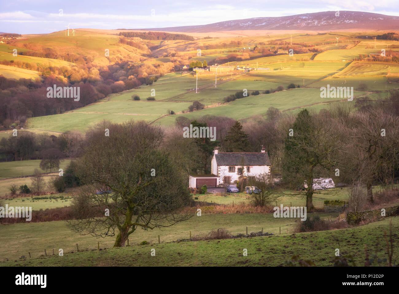 Scenic view of downhill countryside and wind turbines over hills in Lancashire, England UK Stock Photo