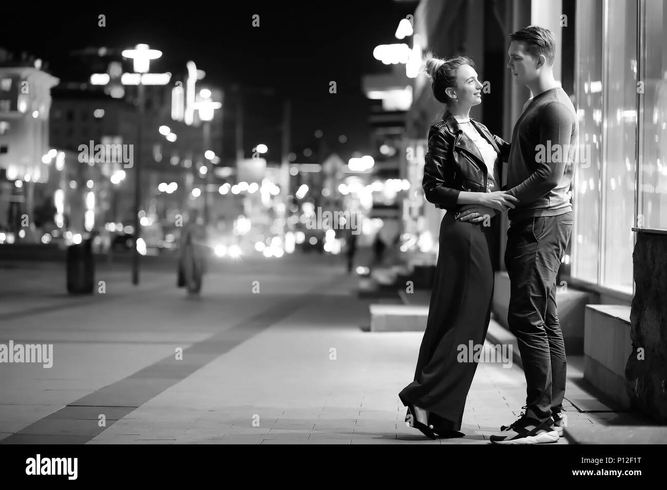 Beautiful couple on a date in a night city outdoor Stock Photo