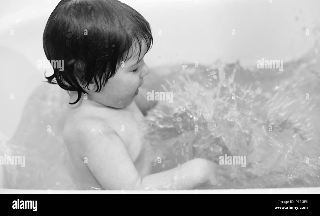 Young children take a bath. Children wash in bathroom. Brother and