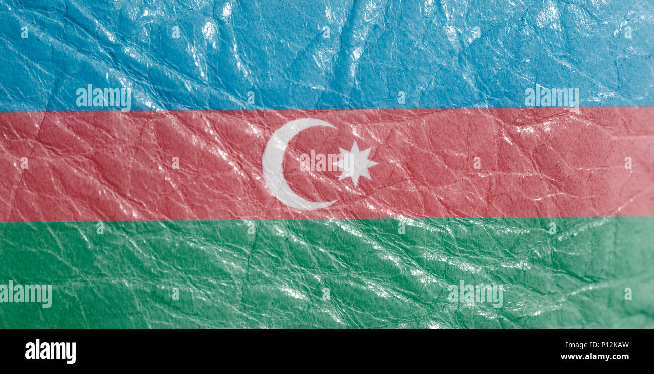 Azerbaijan flag on leather texture background close up . Stock Photo