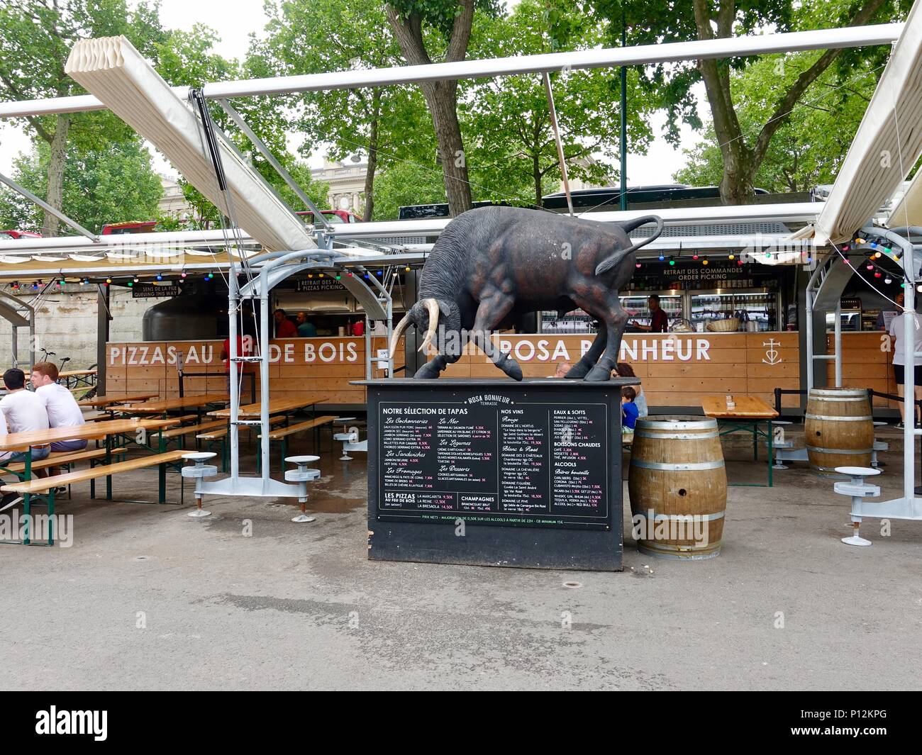 Statue of a bull in front of the Berges de Seine restaurant Rosa Bonheur, Paris, France Stock Photo