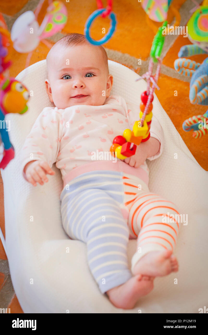 A six month old baby in a baby chair Stock Photo Alamy
