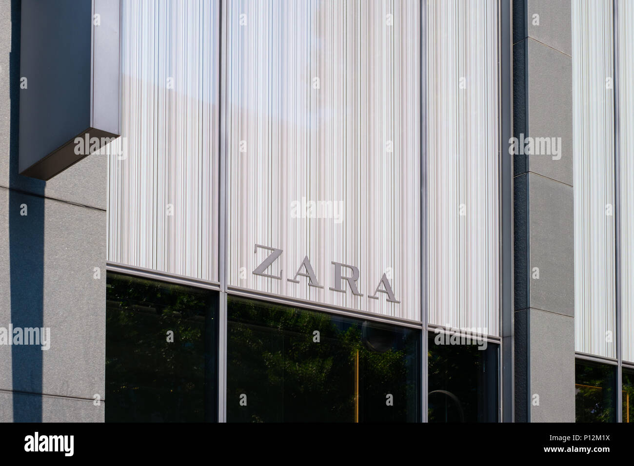 Berlin, Germany - june 09, 2018: The logo / brand name of  ZARA on shop facade exterior in Berlin, Germany.  Zara is a Spanish  fashion, clothing and  Stock Photo