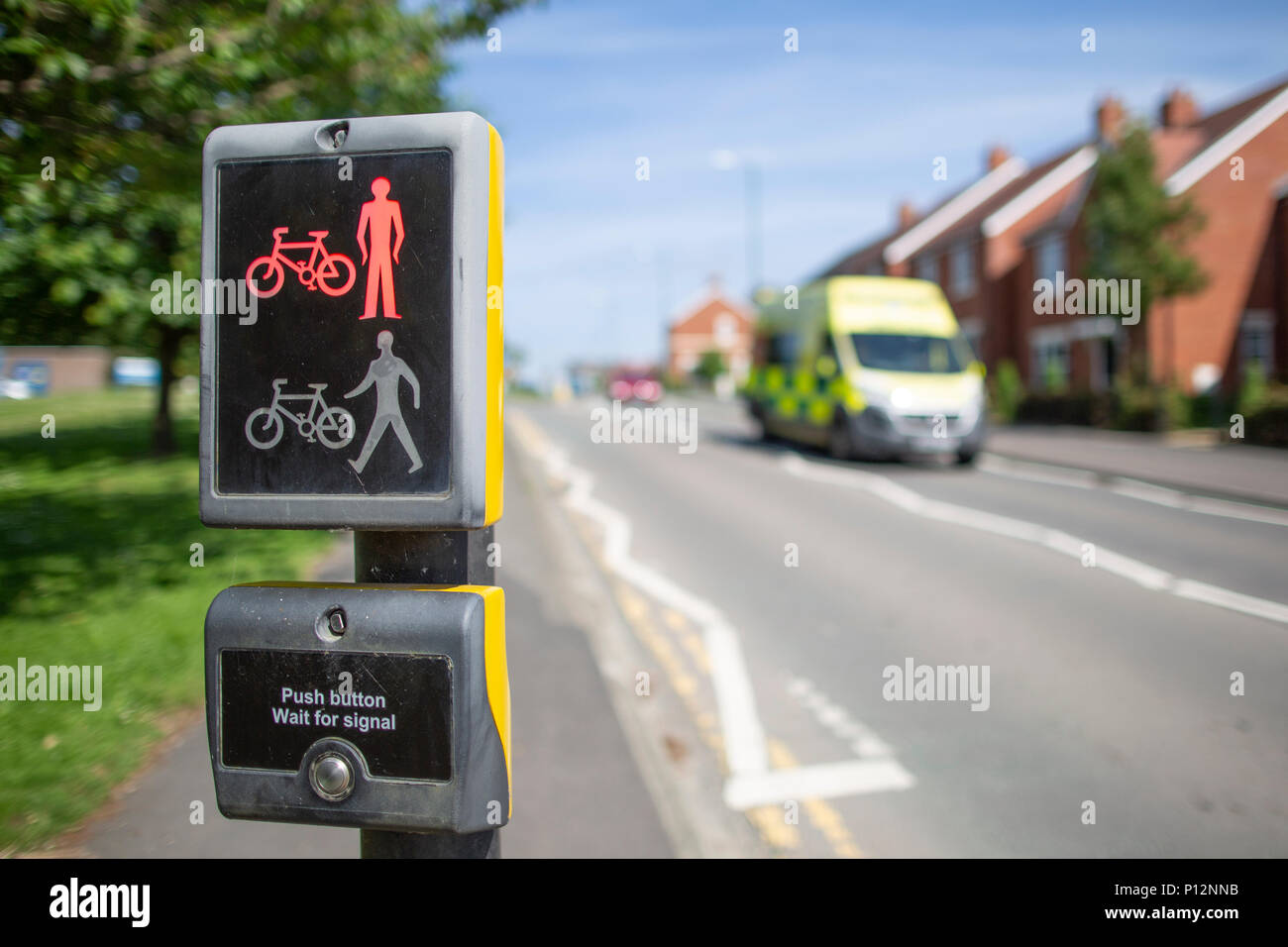 Toucan Crossing as an emergency NHS ambulance approaching near the Royal Shrewsbury Hospital  provide safe road crossings for pedestrians and cyclists Stock Photo