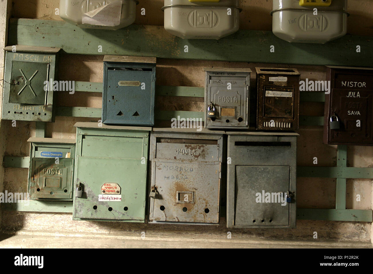 Various mailboxes on wall in Romania Stock Photo