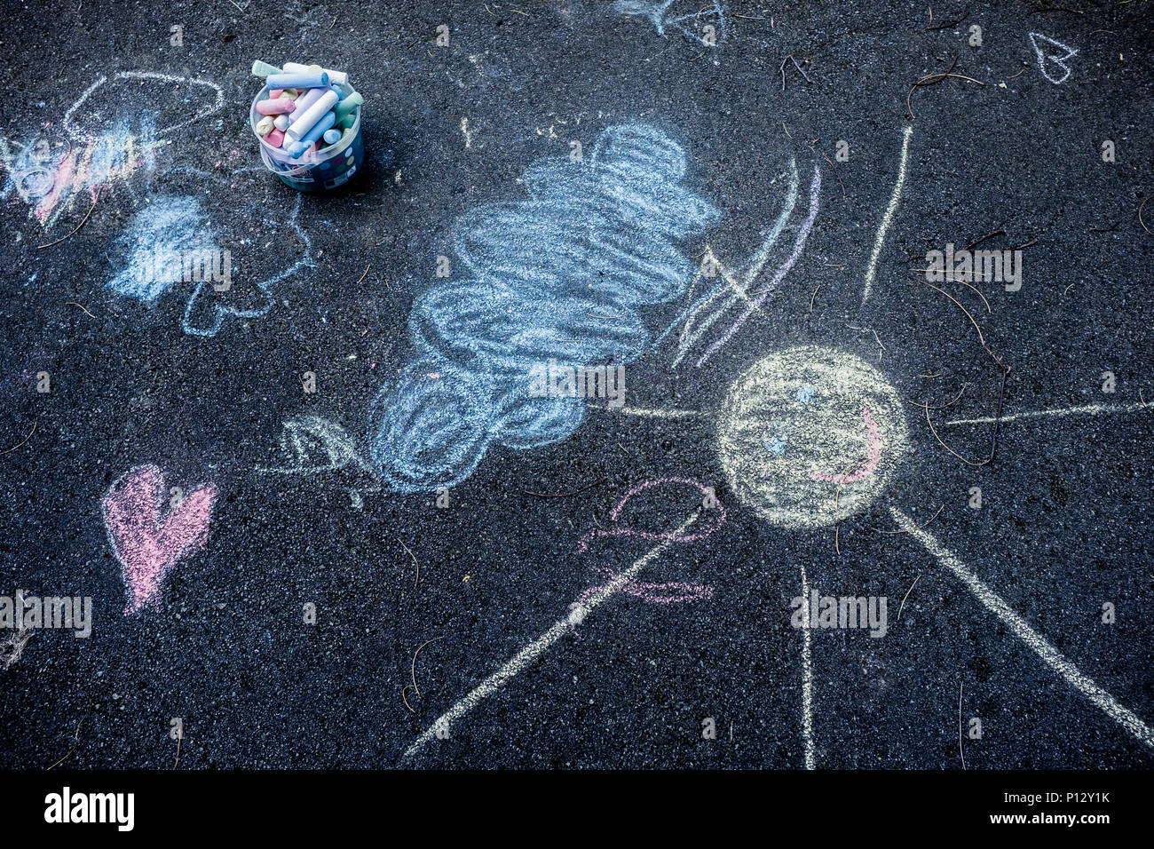 Children chalk drawing on pavement Stock Photo