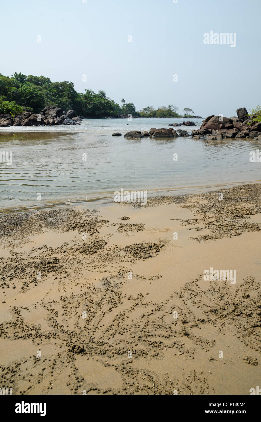 Black Johnson Beach in Sierra Leone, Africa with calm sea and sand patterns made by beach crabs Stock Photo