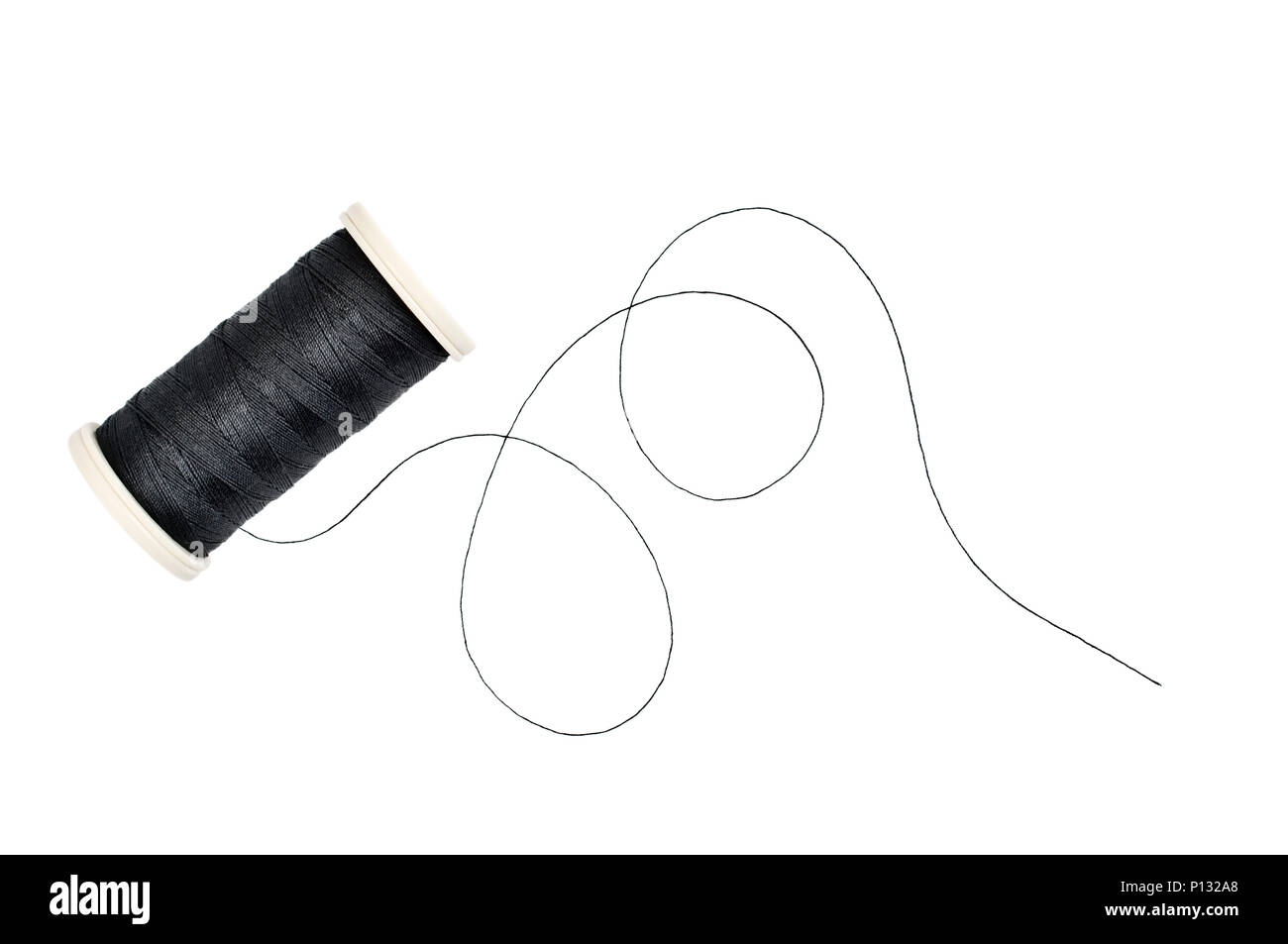 Spool of sewing thread on white background. Stock Photo