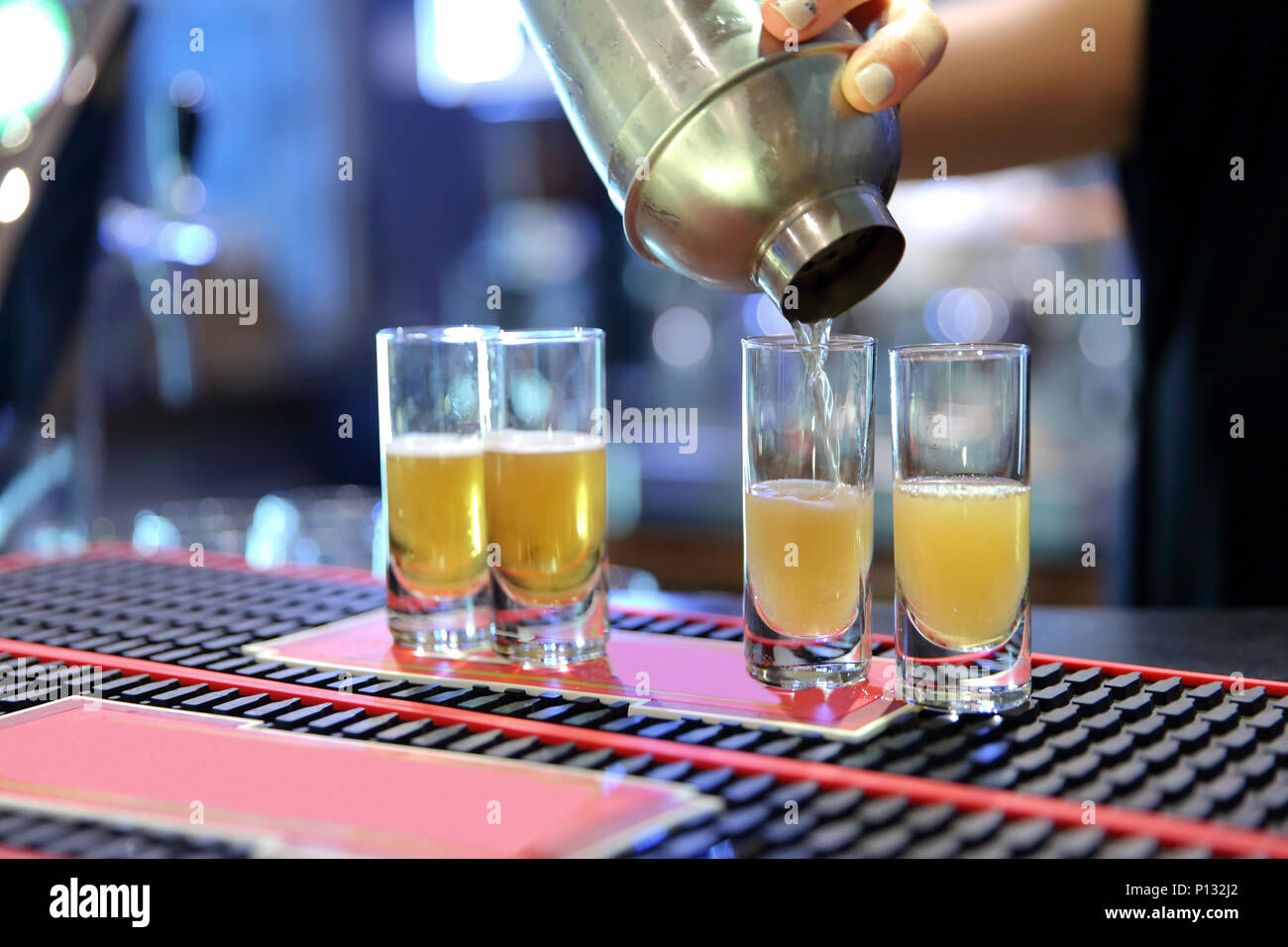 Pouring vodka into a shaker's glass Stock Photo Alamy