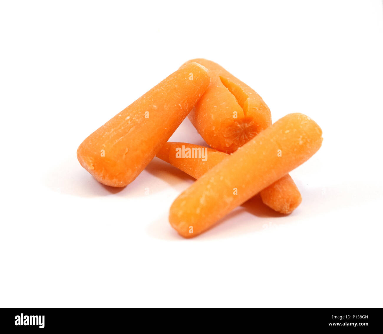 Pile of delicious organic baby carrots isolated Stock Photo Alamy