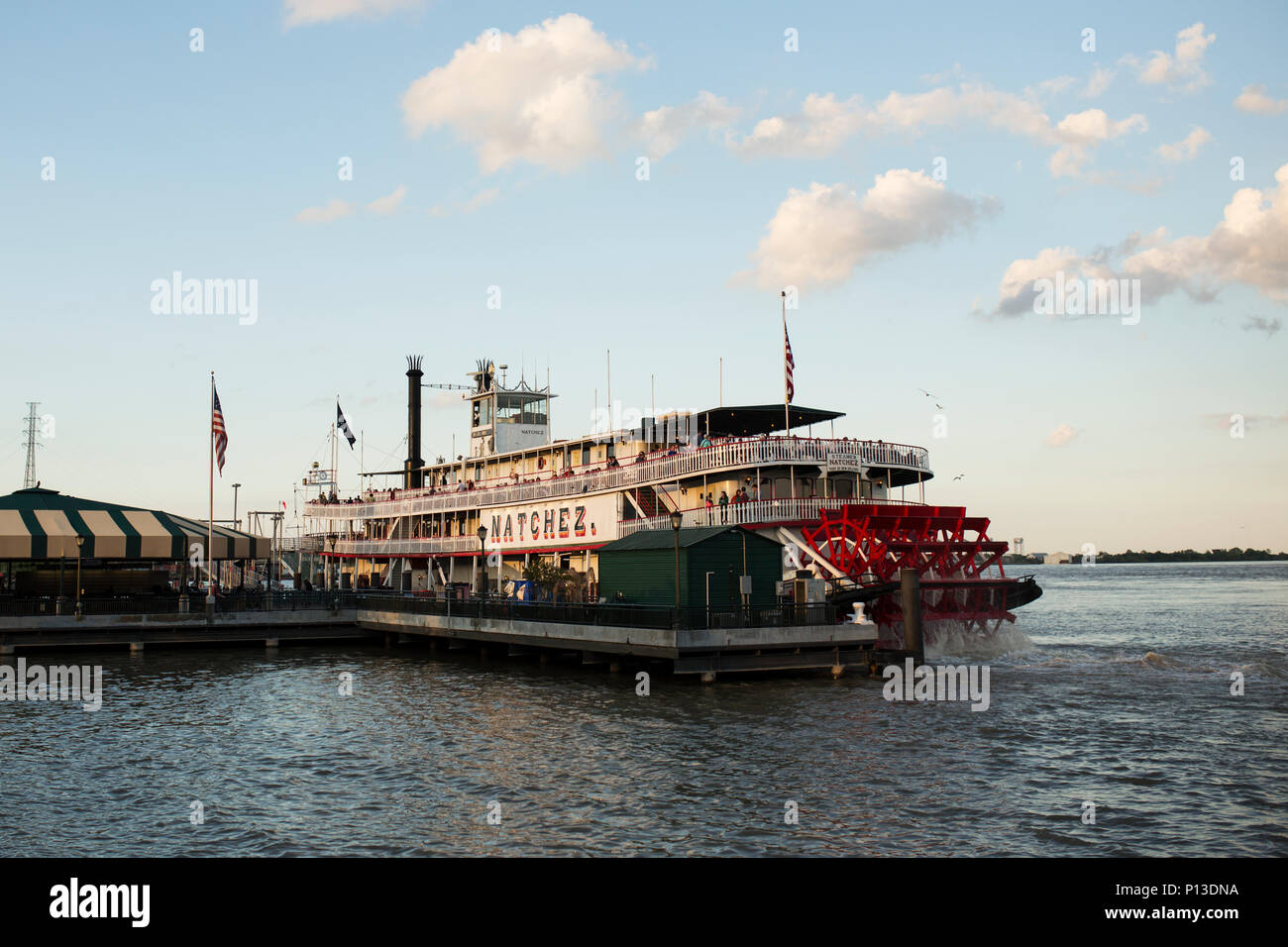 The paddlewheeler Natchez docked at sunset along the Mississippi River in New Orleans, Louisiana. Stock Photo