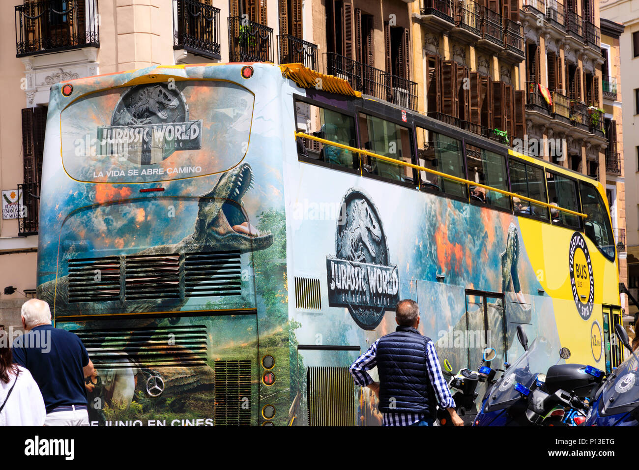 Open top double decker tourist sightseeing bus with Jurassic World movie advertising. Madrid, Spain. May 2018 Stock Photo