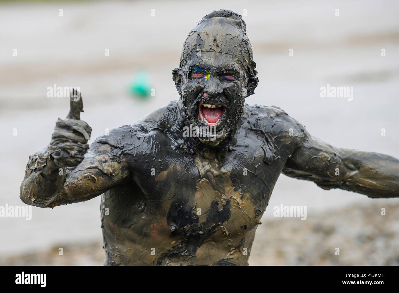 Maldon Mud Race. Joel Hicks, competitor, covered in the slimy mud of ...