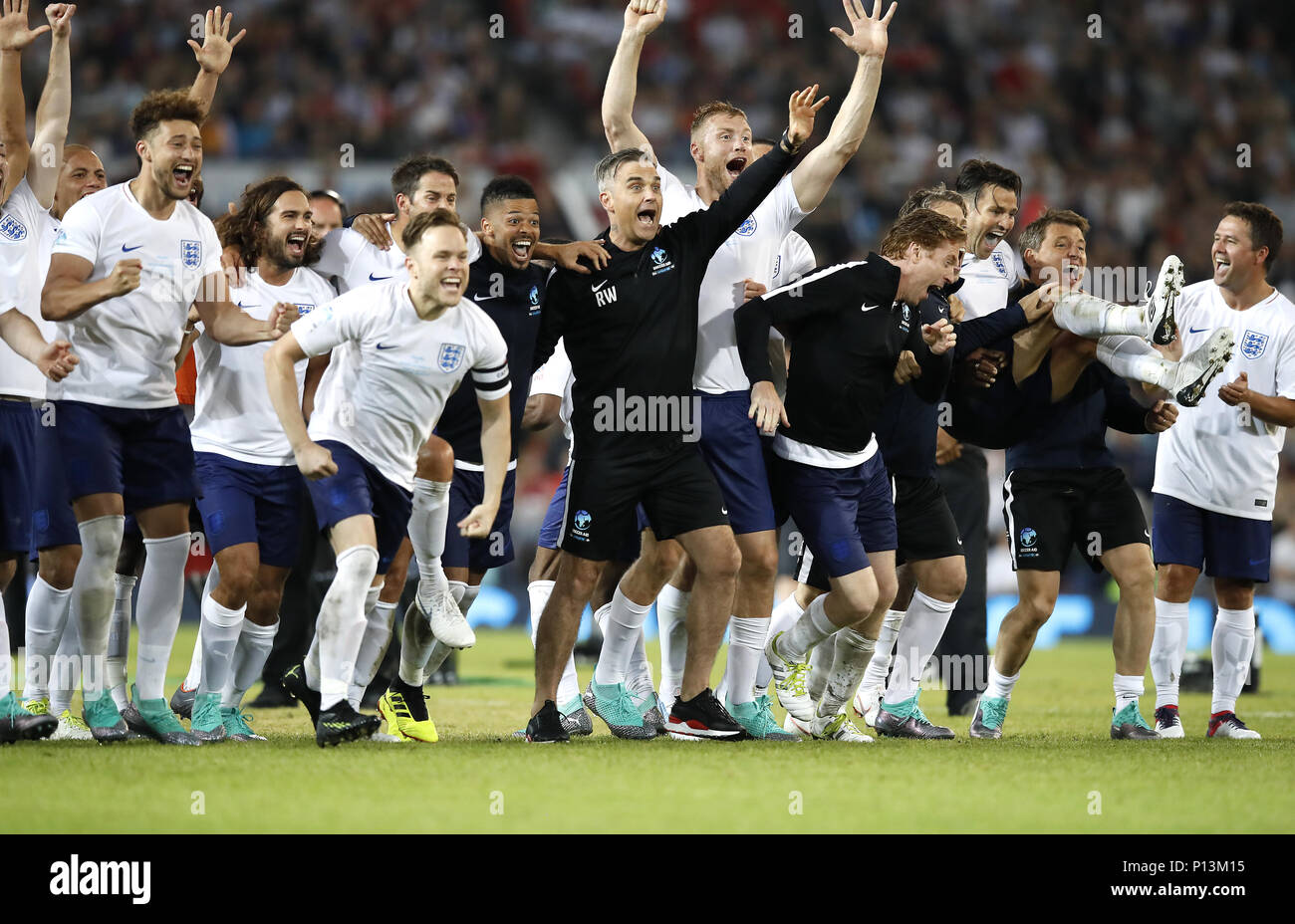 England players celebrate winning the UNICEF Soccer Aid match at Old