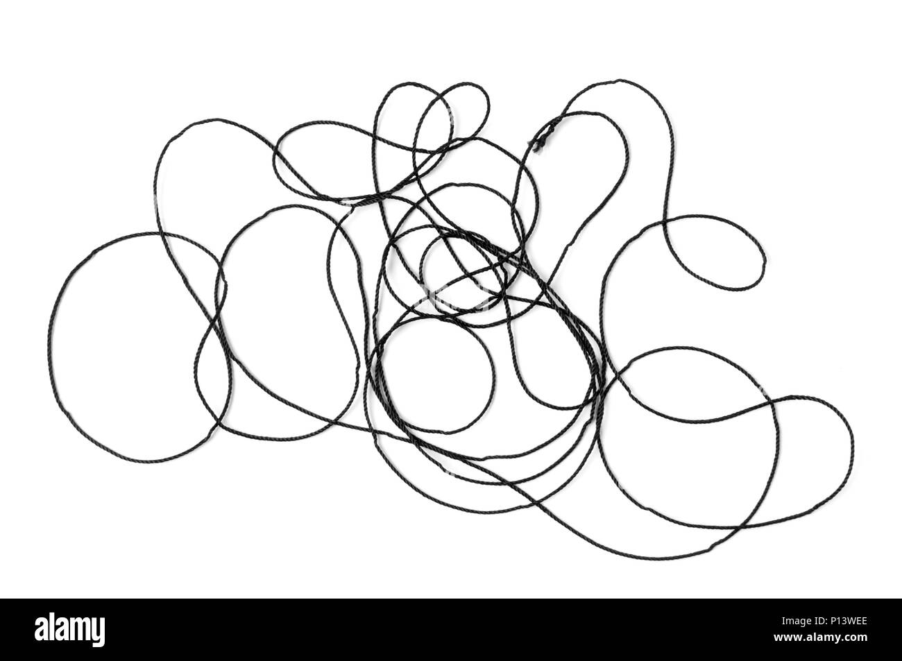 Tangled black thread isolated on white background Stock Photo - Alamy