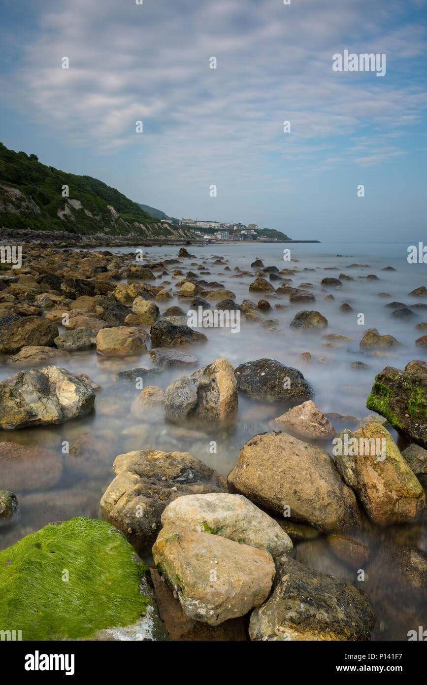 a beautiful and atmospheric seascape or landscape of steephill cove beach at ventnor on the isle of wight. rocky rugged shorline on the island coast. Stock Photo