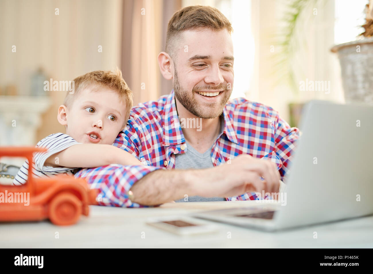 Playing Computer Game with Little Son Stock Photo Alamy