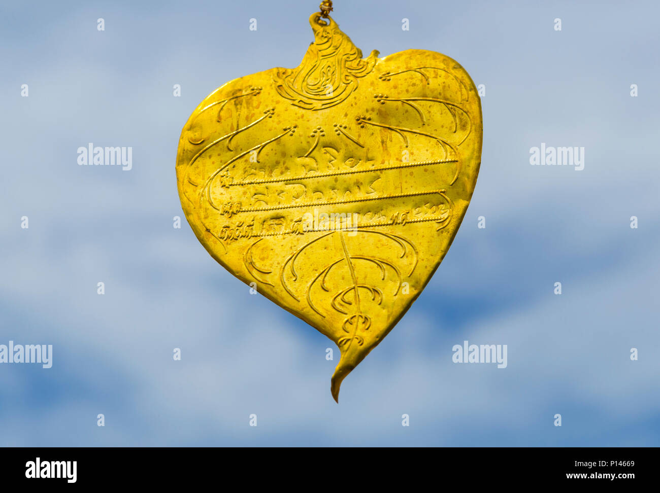 Bo leaves gold trim paint colors with blue sky Stock Photo Alamy