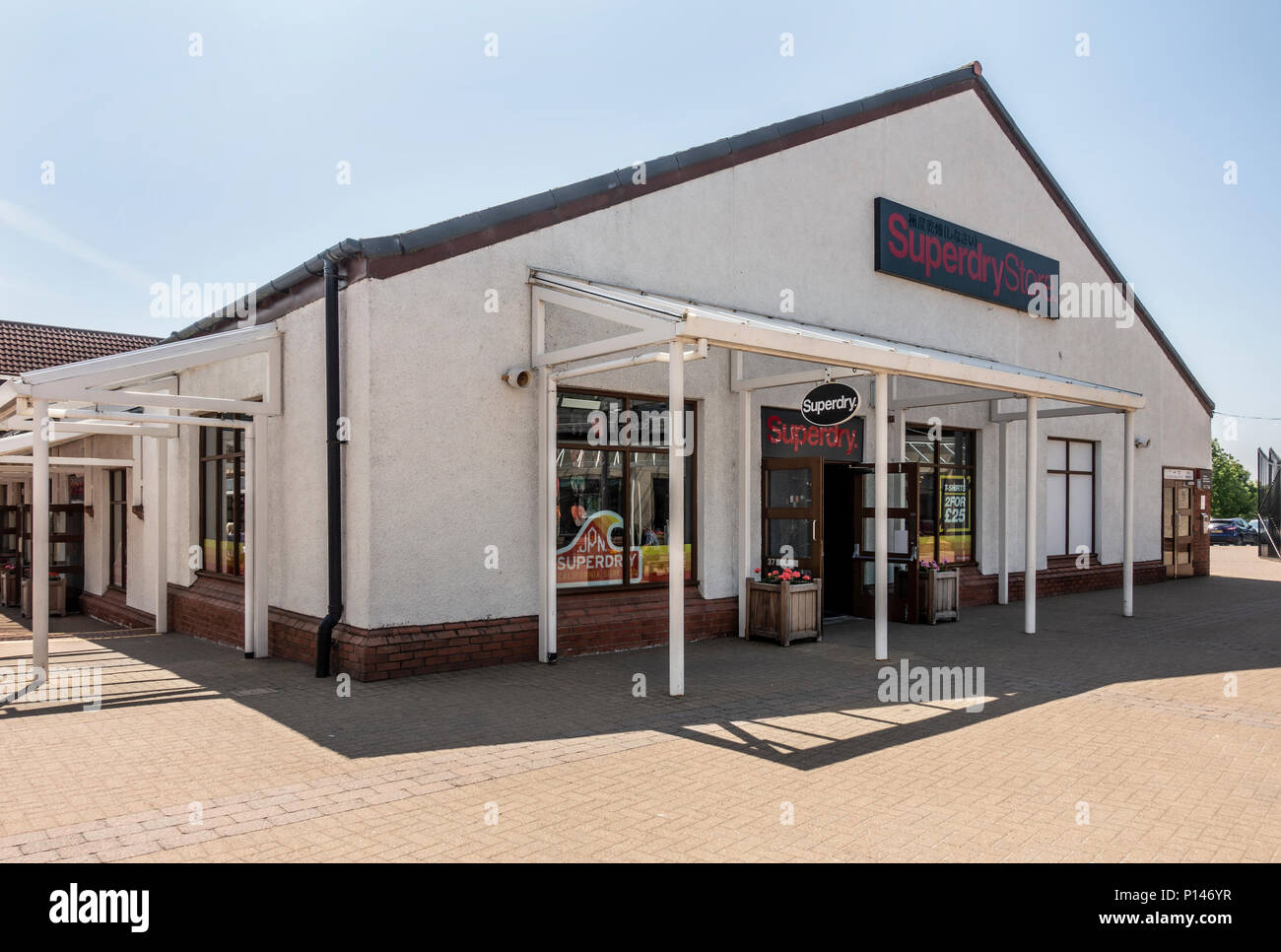 Exterior and entrance to the Superdry shop at the Gretna Gateway Outlet  Village, a 'strip mall' in the very south of Scotland Stock Photo - Alamy