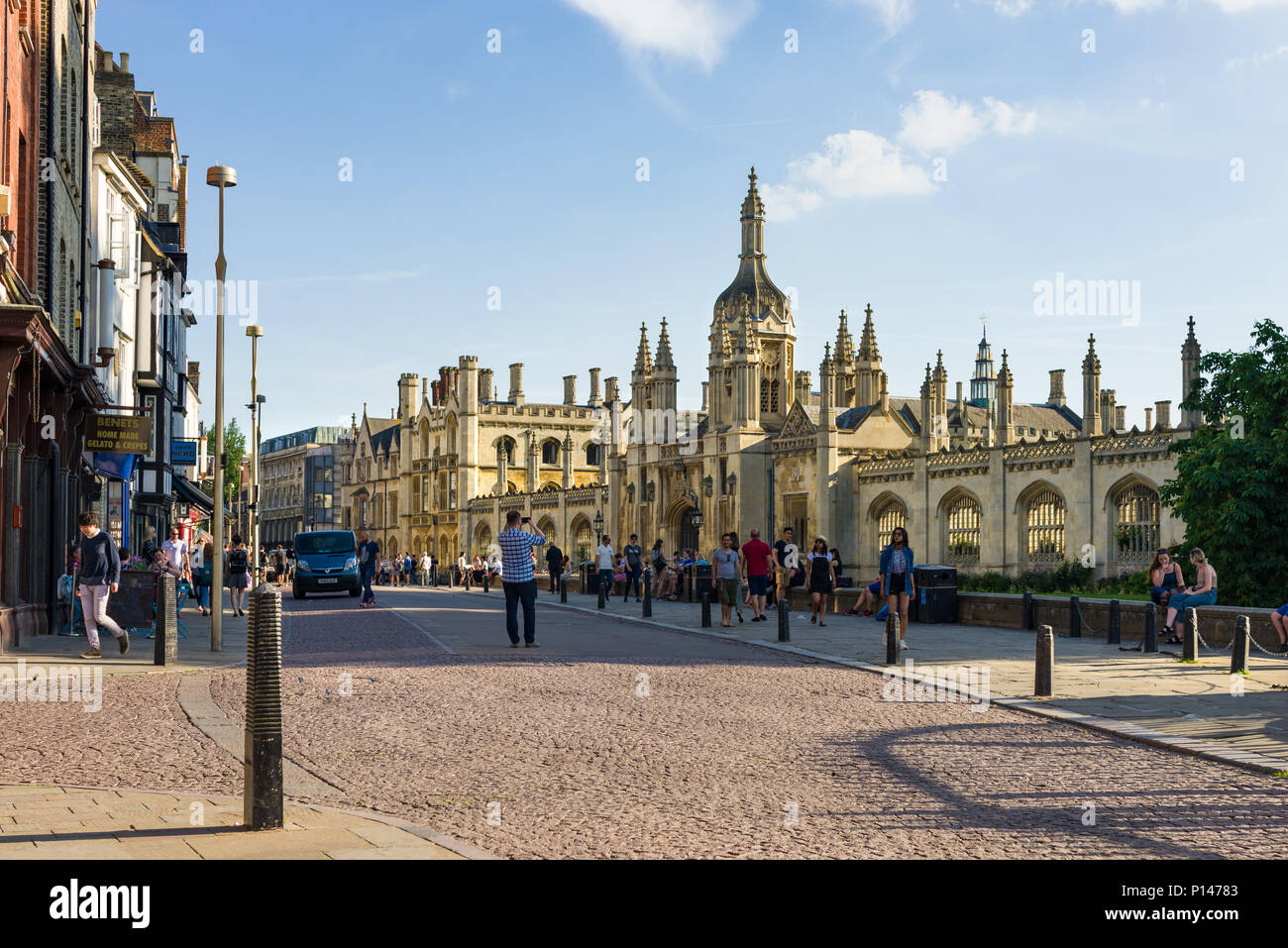 Kings Parade road with people outside Kings College on a late sunny Summer afternoon, Cambridge, UK Stock Photo