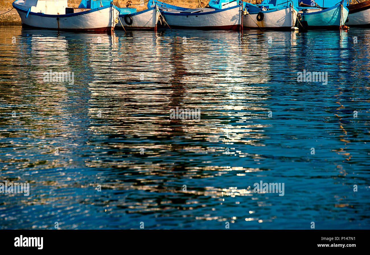 Reflection of boats in the water Stock Photo - Alamy