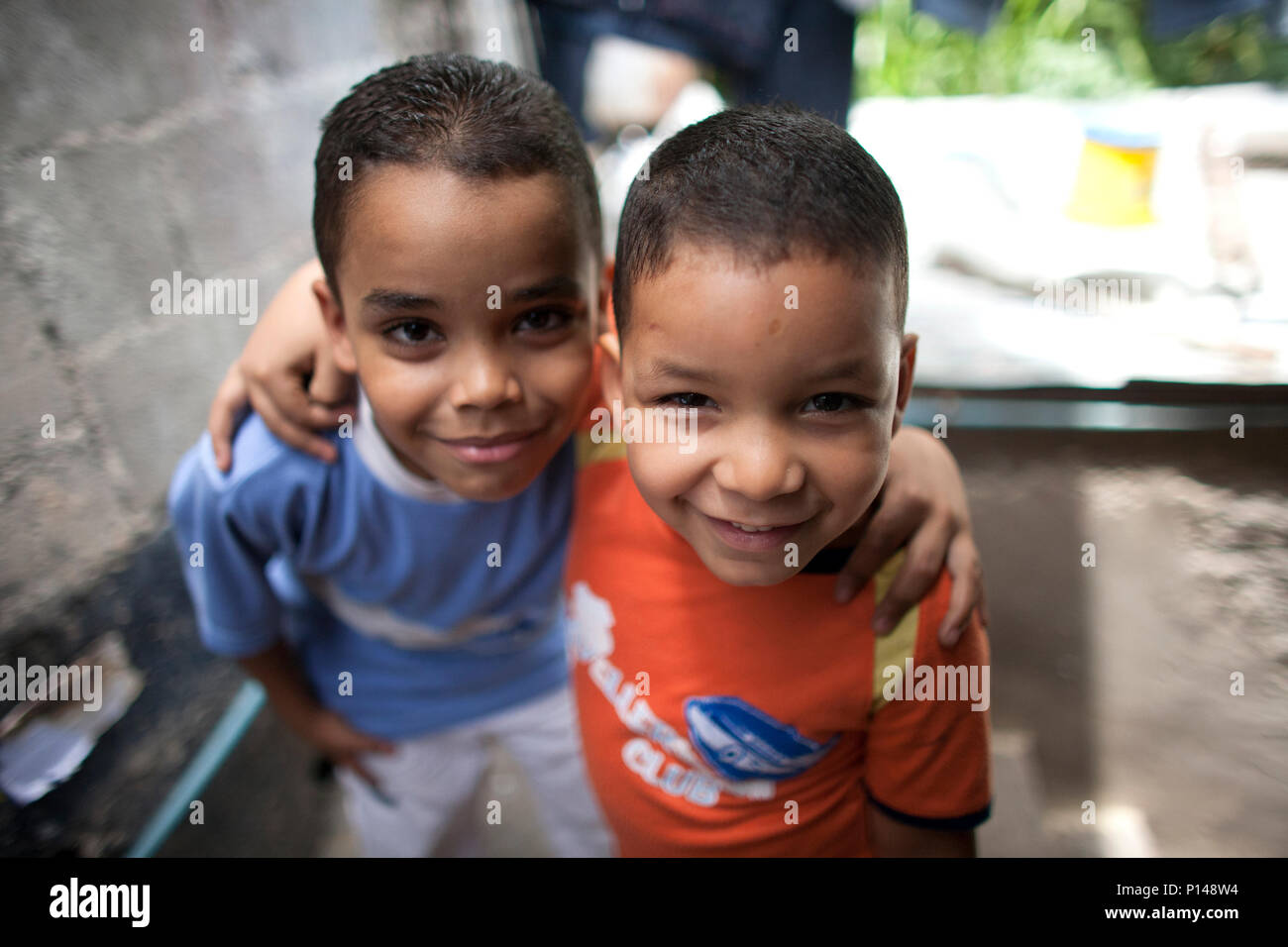 Two boys stand in the home of the organization 'Muchachos de la Calle,' or 'Street Kids' in Los Erasos shanty neighboorhood in Caracas, Venezuela, Jul Stock Photo