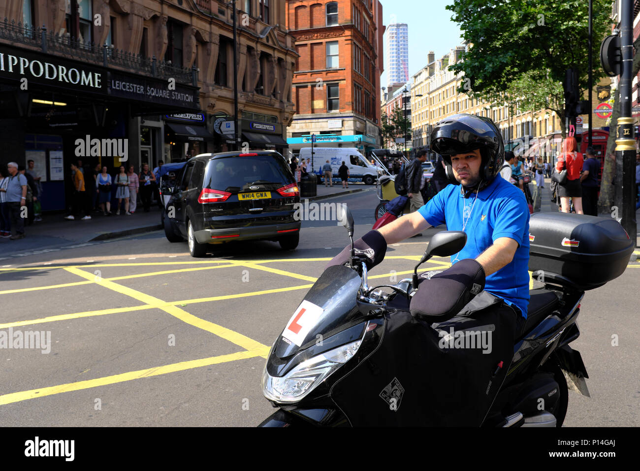 Moped scooter delivery rider, London, England, UK Stock Photo Alamy