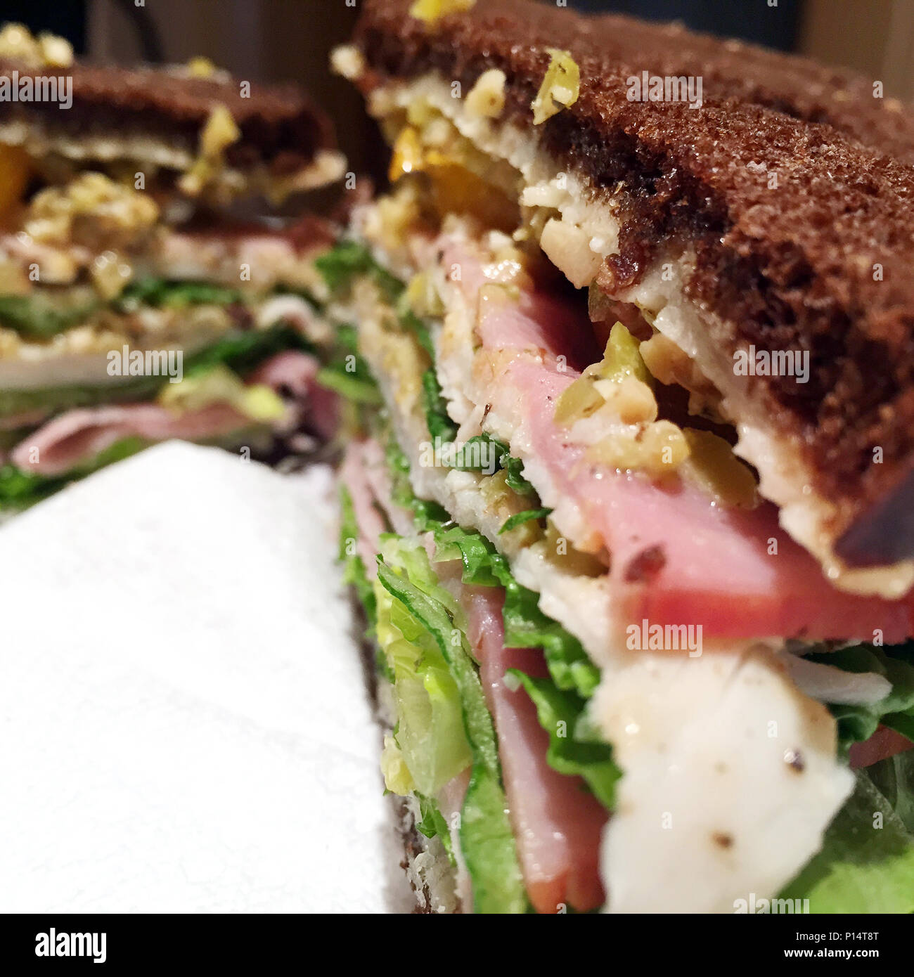 Giant deli cold cut sandwich on pumpernickel bread Stock Photo Alamy