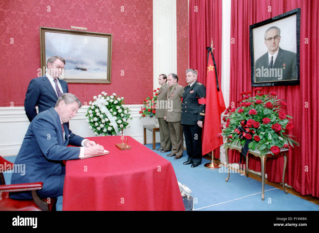 2/13/1984 President Reagan signing Condolence book on death of Chairman of USSR Yuriy Andropov at the Soviet Embassy Stock Photo
