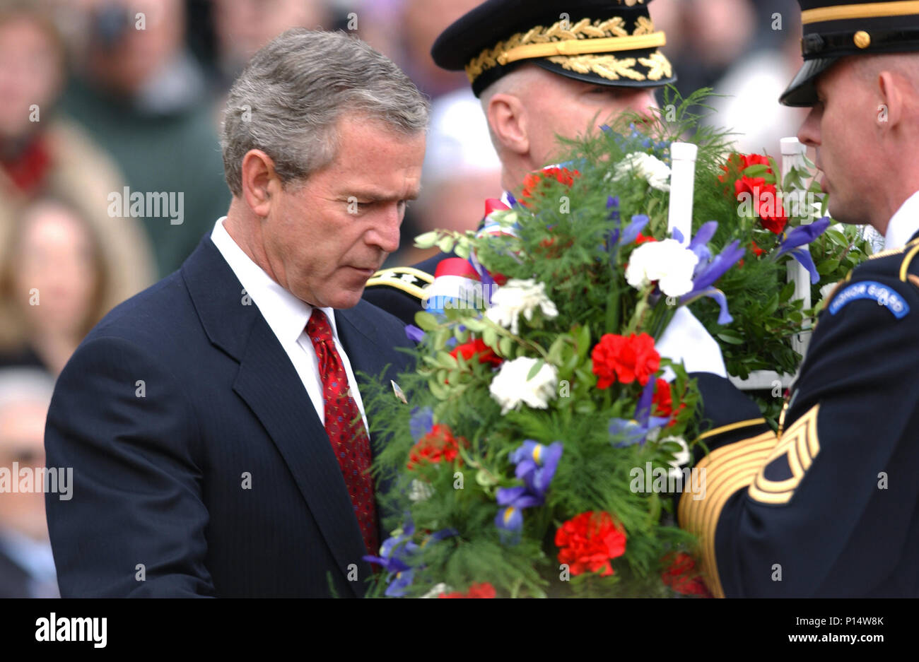 US President George W. Bush lays a wreath at the Tomb of the Unknown Soldier during the 2003 Veteran's Day wreath laying ceremony. Stock Photo