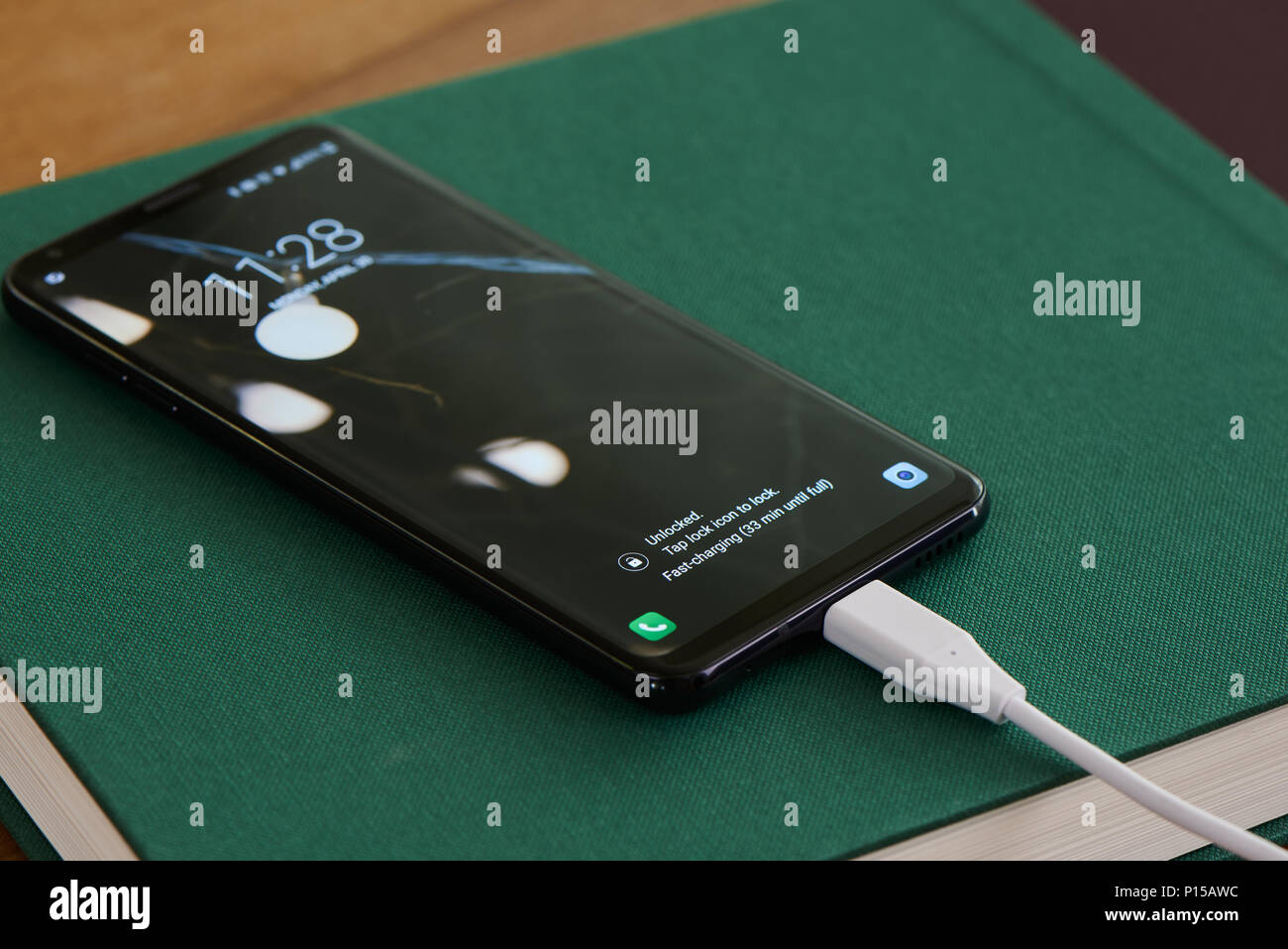 closeup of fast-charging notification on smartphone display Stock Photo