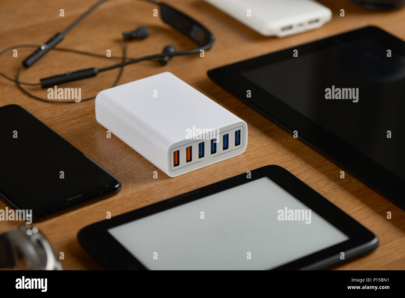 multiport charging station with smart phone and general single port charger Stock Photo
