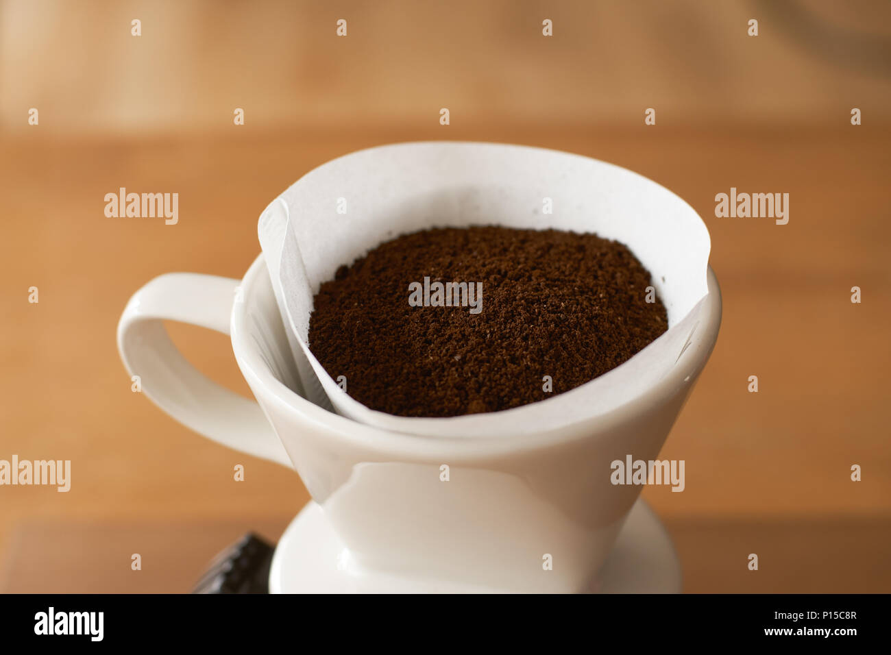 ceramic hand drip coffee brewer (dripper) and drip ground coffee Stock