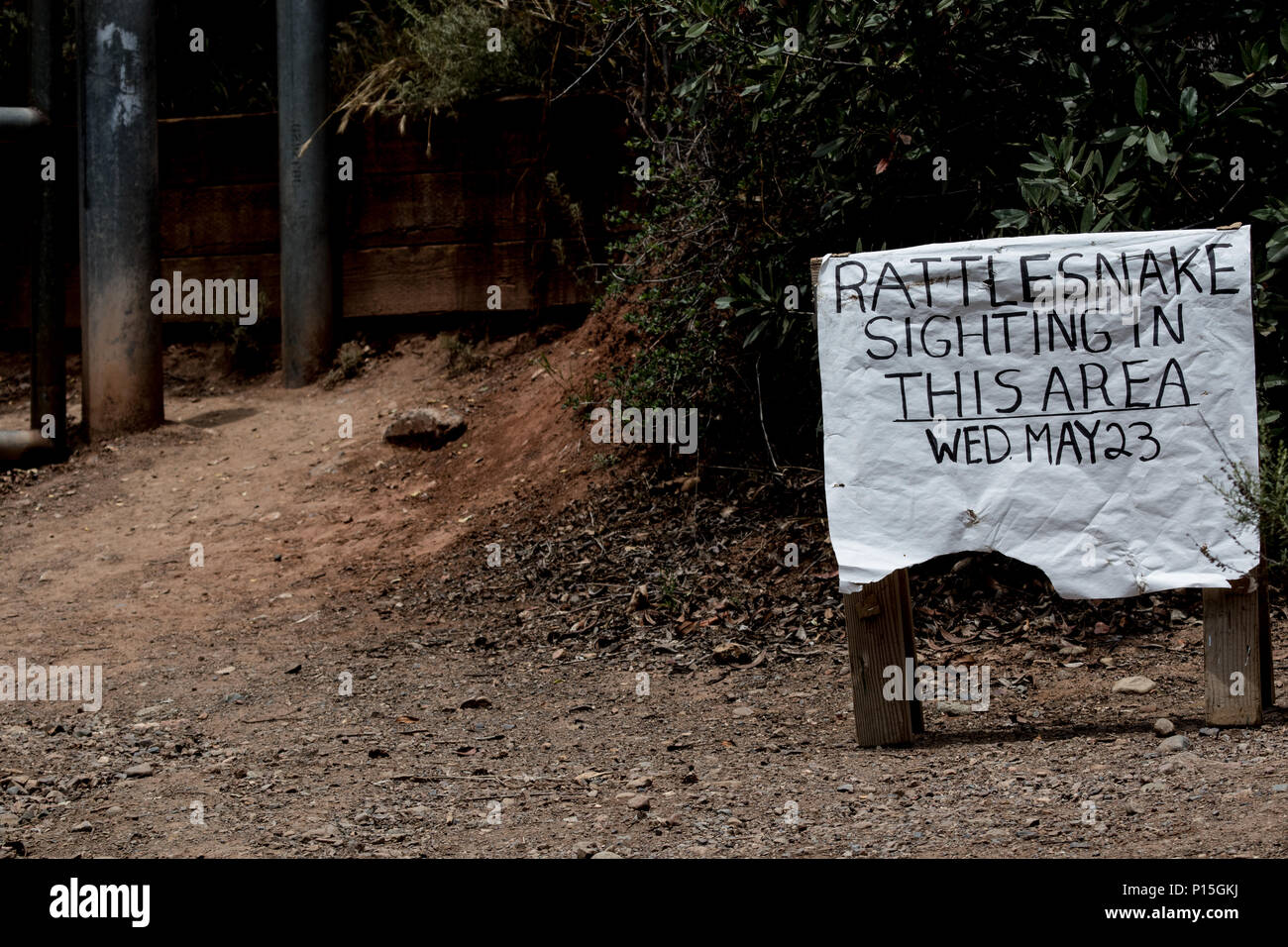 rattlesnake warning sign on a trail in Orange County, California, USA Stock Photo