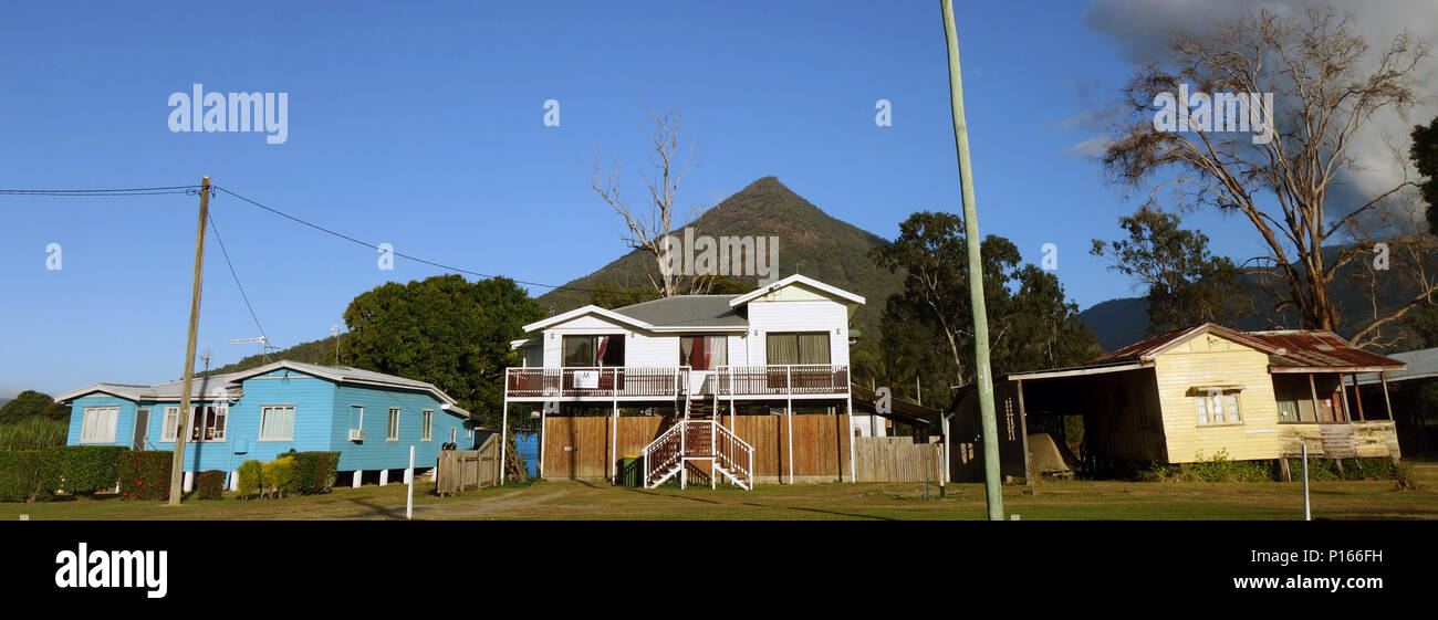 Panorama of three different generations of Queenslander houses