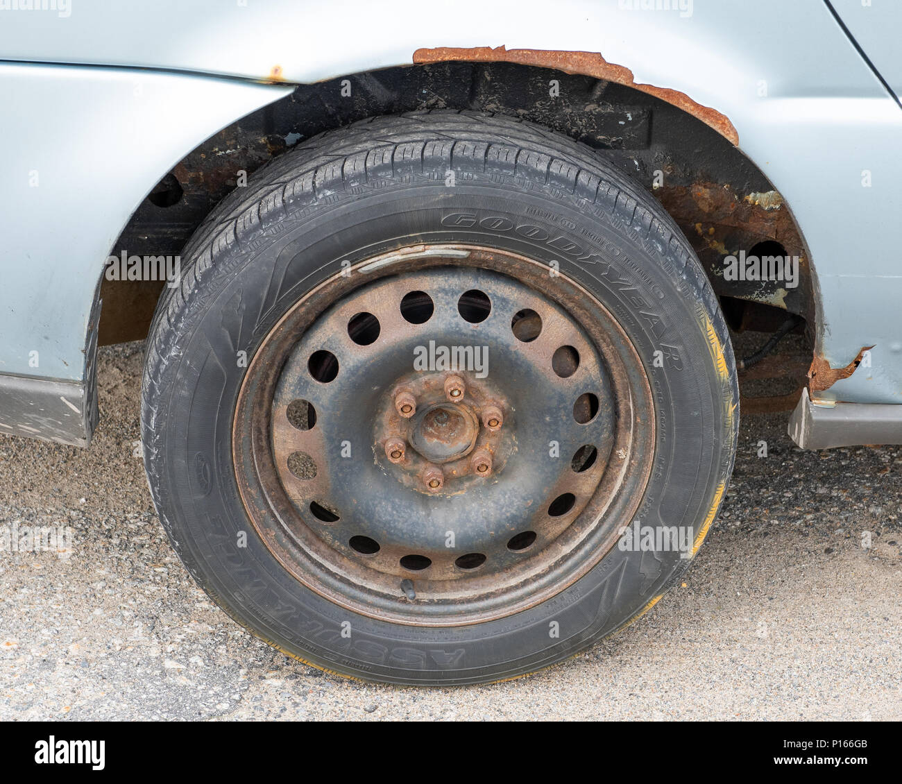A rusty neglected wheel and fender on an automobile Stock Photo - Alamy