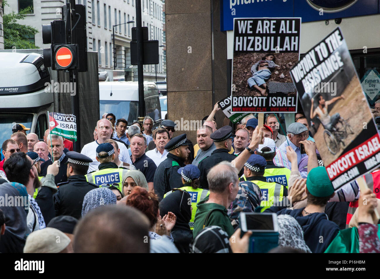 London, UK. 10th June, 2018. Members of a far-right group taunt hundreds of people taking part in the pro-Palestinian Al Quds Day march through central London organised by the Islamic Human Rights Commission. An international event, it began in Iran in 1979. Quds is the Arabic name for Jerusalem. Credit: Mark Kerrison/Alamy Live News Stock Photo