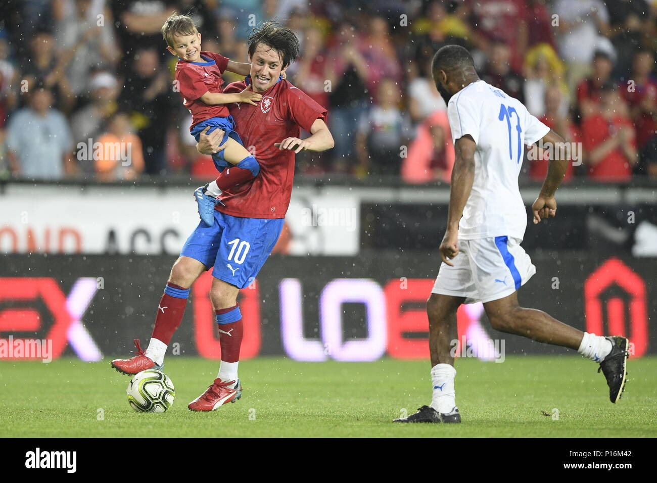 Tomas Rosicky and his son Tomas Rosicky Jr of Czech team and Alex Song of TR10 World Team in action during the match. Former captain of the Czech national football team Tomas Rosicky definitely ended his career at the age of 37 in a farewell match played despite a driving cloudburst which postponed its kickoff today, on Saturday, June 9, 2018. The Czech team, in which he played, defeated the 'team of the world,' composed of his former fellow players from Borussia Dortmund and Arsenal London, 5-2. The final goal was scored by Rosicky's four-year-old son Tomas. Weather complicated the farewell m Stock Photo