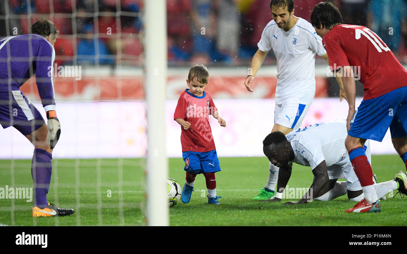 L-R TR10 World Team goalkeeper Jens Lehmann, Tomas Rosicky Jr of Czech team, Mathieu Flamini and Bakary Sagna of TR10 World Team and father Tomas Rosicky in action during the match. Former captain of the Czech national football team Tomas Rosicky definitely ended his career at the age of 37 in a farewell match played despite a driving cloudburst which postponed its kickoff today, on Saturday, June 9, 2018. The Czech team, in which he played, defeated the 'team of the world,' composed of his former fellow players from Borussia Dortmund and Arsenal London, 5-2. The final goal was scored by Rosic Stock Photo