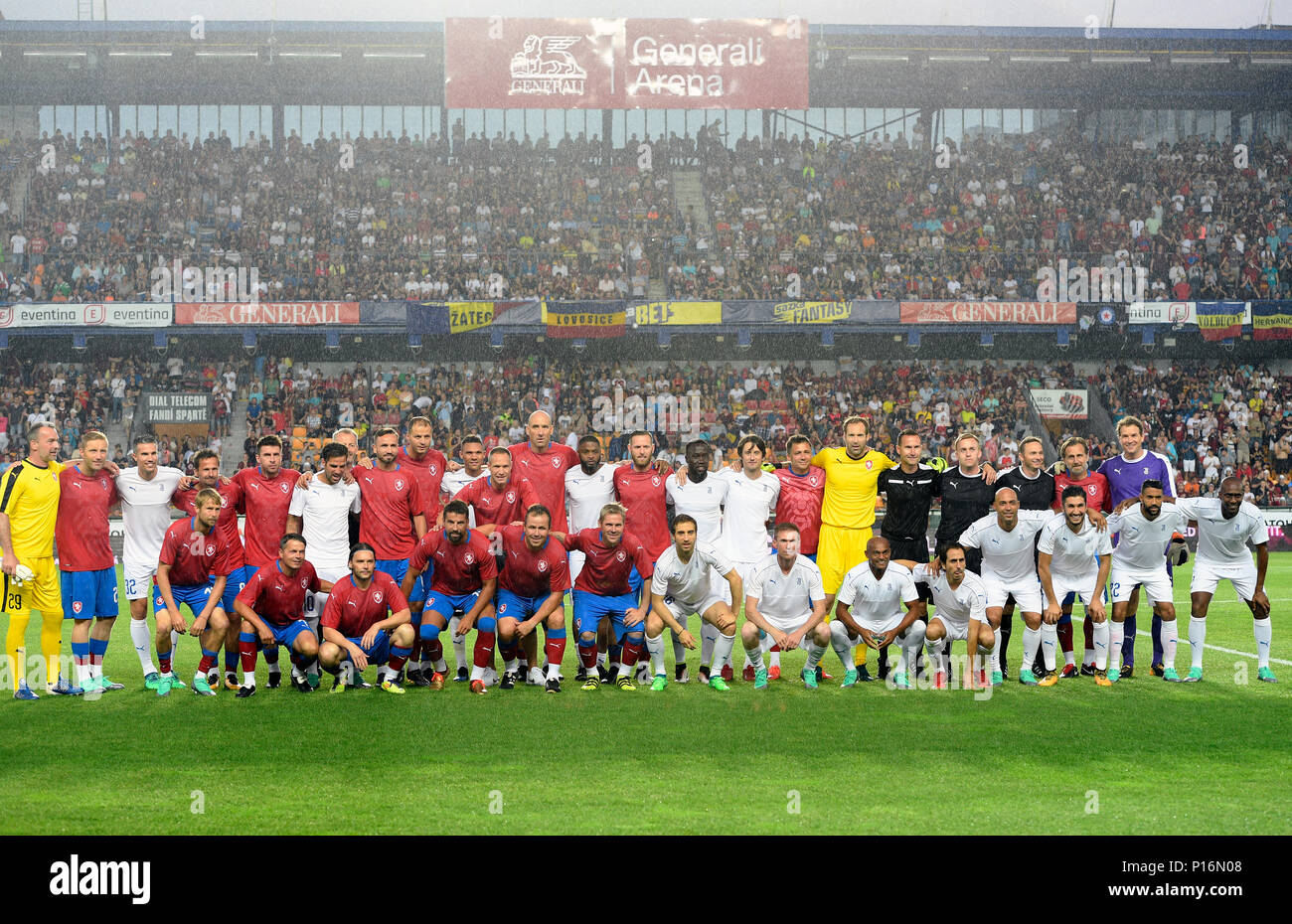 A family photo prior to the TR10 Czech Team vs Alex Song of TR10 World Team match. Former captain of the Czech national football team Tomas Rosicky definitely ended his career at the age of 37 in a farewell match played despite a driving cloudburst which postponed its kickoff today, on Saturday, June 9, 2018. The Czech team, in which he played, defeated the 'team of the world,' composed of his former fellow players from Borussia Dortmund and Arsenal London, 5-2. The final goal was scored by Rosicky's four-year-old son Tomas. Weather complicated the farewell match as roughly 20 minutes before i Stock Photo