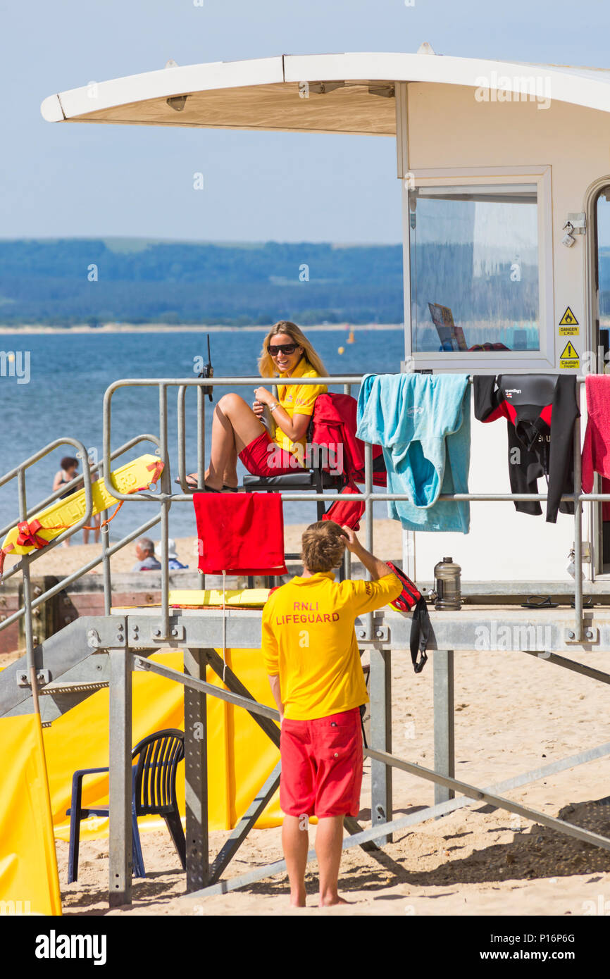 Bournemouth, Dorset, UK. 11th June 2018. UK weather: lovely very warm sunny start to the day at Bournemouth beaches as temperatures rise and visitors head to the seaside to enjoy the sunshine.  RNLI Lifeguards on duty. Credit: Carolyn Jenkins/Alamy Live News Stock Photo