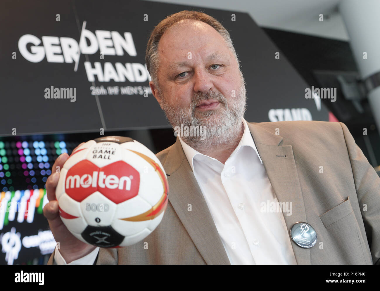 11 June 2018, Berlin, Germany: Andreas Michelmann, DHB President holds a ball during the presentation of Berlin's Handball world cup embassador. Photo: Jörg Carstensen/dpa Stock Photo