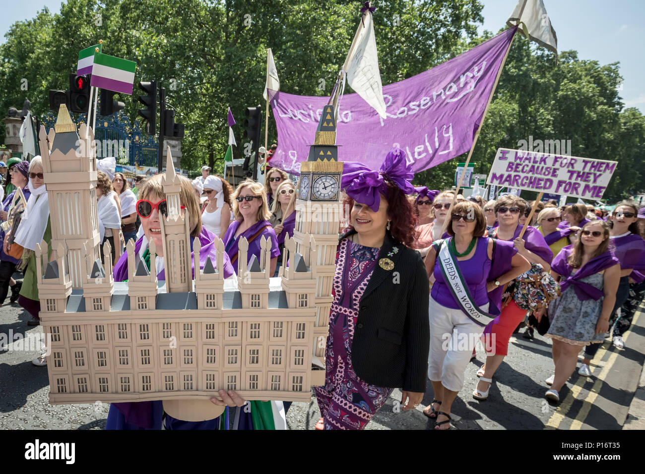 London, UK. 10th June 2018. Thousands of women join Processions 2018. Dressing in the green, white and purple tri-colour scheme of the Suffragette’s Women's Social and Political Union, they marched from Hyde Park to Parliament Square to mark 100 years since the Representation of the People Act, which gave British women the right to vote and stand for public office in the UK. Credit: Guy Corbishley/Alamy Live News Stock Photo